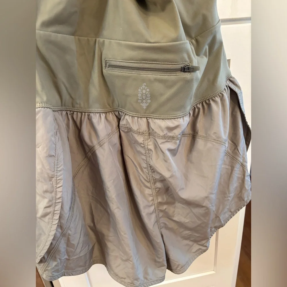 new Free People righteous runsie active romper in sage stone green